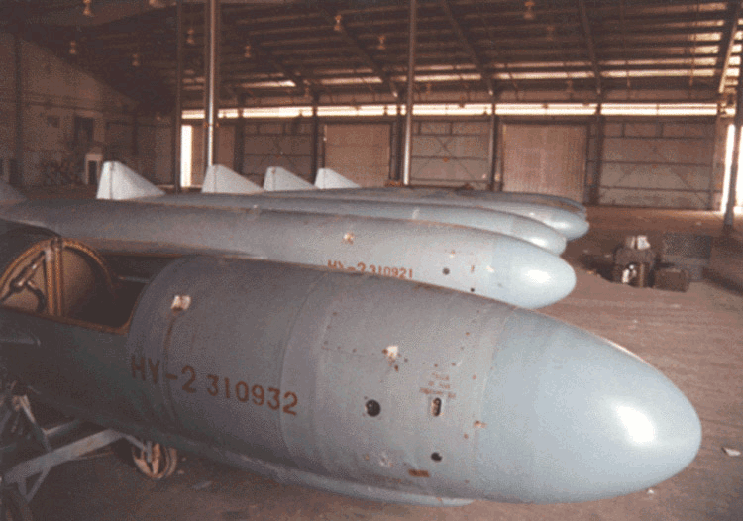 Figure 5. This is a photograph of six Seersucker missiles captured at the Kuwaiti Girls' School awaiting transport to the US. Note the serial number on the first missile above matches that of the missile at the Kuwaiti Girls' school in Figure 4. Photograph taken by US Naval officer, March 1991, at Shubaiha Port.